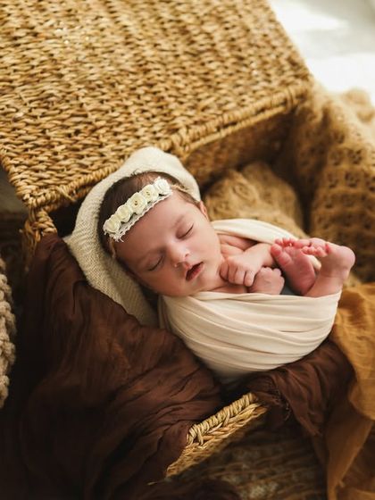 A little boho vibe for this sleeping newborn. I love using elements like pampas grass and woven textures for these earthy setups.