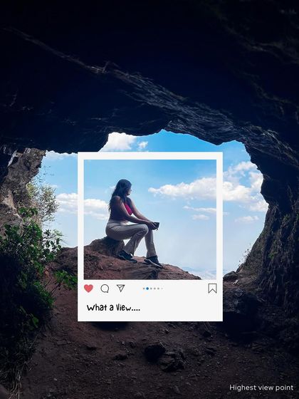 What a view! A traveler sits at the mouth of a cave, looking out at the sky. My Chikmagalur trips are about finding these secret spots with incredible views.