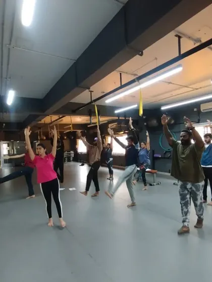 Students participating in a dynamic warm-up, led by a master trainer. We emphasize the importance of proper preparation before any workout.