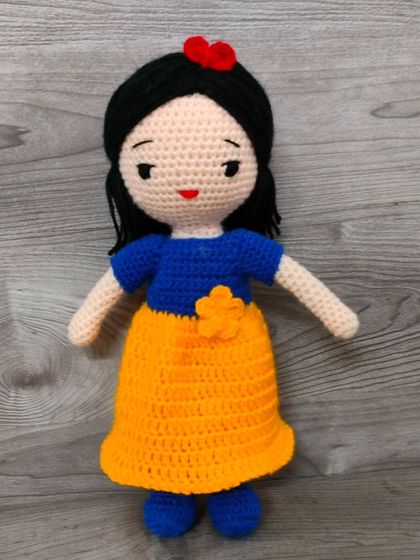 This is the princess Snow White. I made her classic dress with a yellow skirt and blue top.