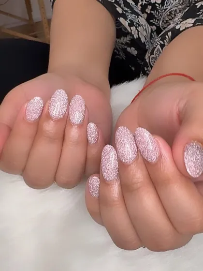 Another view of the intensely sparkly pink reflective glitter nails.