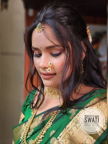 A beautiful shot of Anuja's engagement look. The soft, loose hair and natural makeup create a romantic and modern feel.