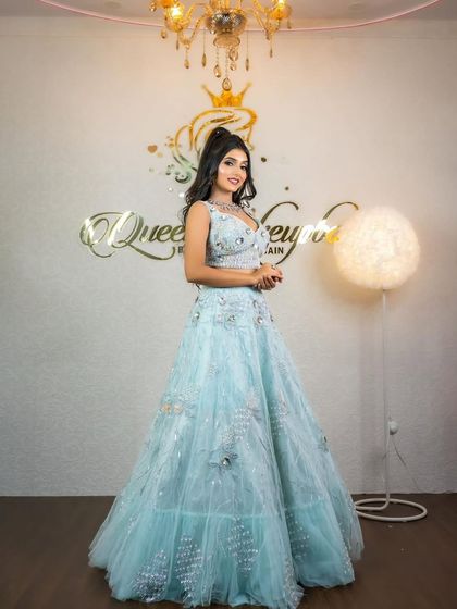 A full shot of the model in the sky-blue lehenga, looking like a princess.