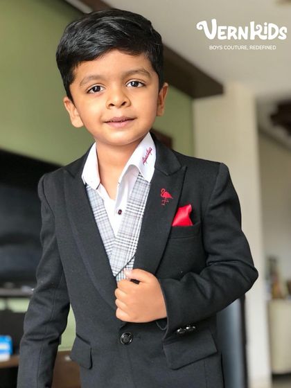 A close-up of the outfit that inspired Vern Kids. This custom-made three-piece suit, styled by me for my son, was the beginning of our journey.