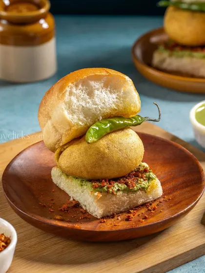 Mumbai's famous Vada Pav, shot for Gulab Sweets. The image highlights the soft pav, crispy vada, and spicy chutney.