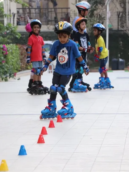 We use cones and other tools to make learning fun. Here, a young skater practices his slalom skills during a class in a Bengaluru apartment complex.