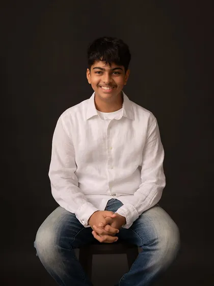 A warm, smiling portrait that captures his friendly nature. Even with a simple setup, we can create a variety of expressive images.