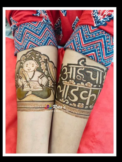 A close-up of the arm designs, showing the 'batu' portrait and the heartfelt phrase for the mother.