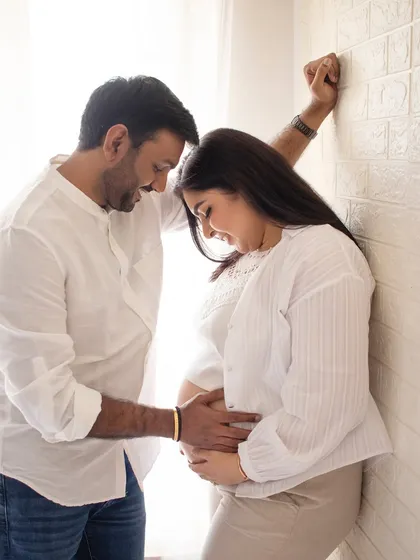 A quiet, intimate moment between a couple against a simple wall. These are the simple, authentic shots I love to capture.