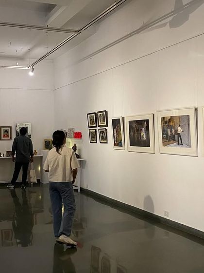 A wide view of the 'SOUTHERN STARS' exhibition, showing how photographs and objects are combined to create a rich, multi-layered experience.