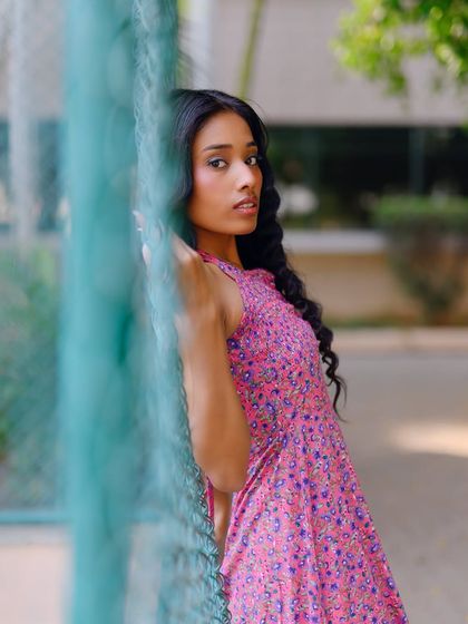 Another angle using the fence as a foreground element, creating a sense of looking in on a private moment.