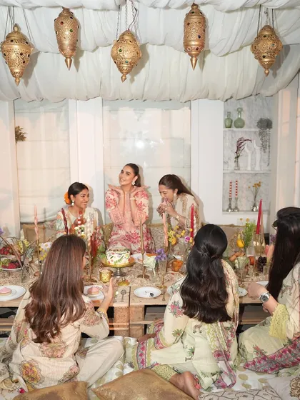 Guests enjoying the beautiful, low-seating arrangement at the Iftaar party, creating an intimate and communal dining experience.