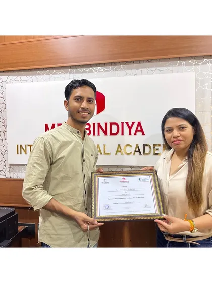 We welcome students from all backgrounds. Here, one of our male graduates proudly accepts his certificate, ready to make his mark as a professional nail technician.