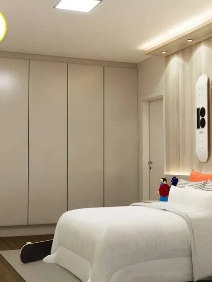 This view shows the full-height white wardrobe that provides ample storage and contrasts nicely with the wood-paneled feature wall.