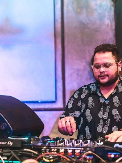 The only time I feel alive is when I'm behind the decks. A focused shot showing my deep connection to my craft.