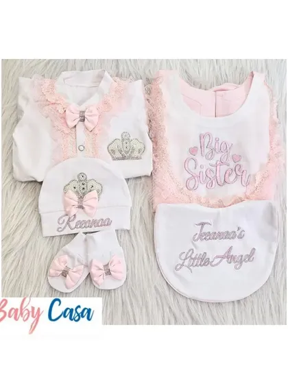 A 'Big Sister' and 'Little Angel' set for a growing family. We design these personalized newborn and sibling outfits to make the arrival of a new baby even more special.