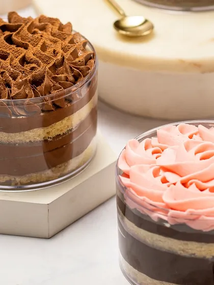 A glimpse of my Rakhi menu, featuring a variety of my bestselling cakes in easy-to-share tubs, like this Tiramisu-inspired tub and a floral-topped chocolate tub.