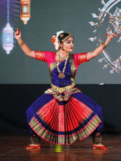 A student from the open category holding a powerful pose. Her strong and confident performance won her 1st place.