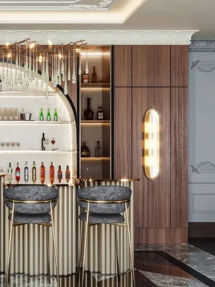 A close-up of the bar, highlighting the backlit shelving and the plush, custom bar stools.