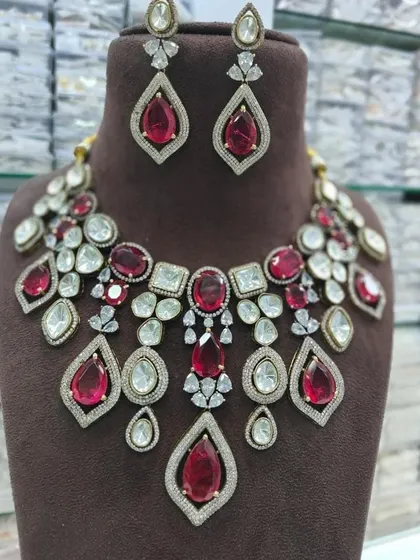 A ruby red version of the multi-color statement necklace. This rental piece is perfect for pairing with a red or gold outfit.