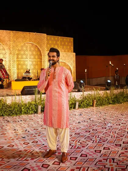 A happy, candid moment on stage in a pink kurta. My smile is my best accessory.