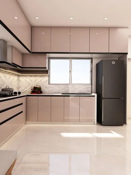 Another view of the blush-toned kitchen, highlighting the sleek black accents on the handles and appliances that provide a modern contrast.