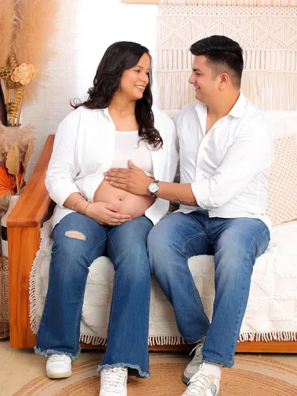 Maternity sessions are a celebration of anticipation and love. Here, in our warm and cozy studio setup, I captured a quiet, intimate moment between the expecting parents. The soft lighting and natural textures create a serene atmosphere for this special time.