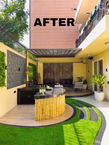 This backyard was completely reimagined as an entertainment hub. The transformation includes a bamboo-clad bar, a raised deck with a pergola for shaded seating, and a unique lawn design with stone pathways.