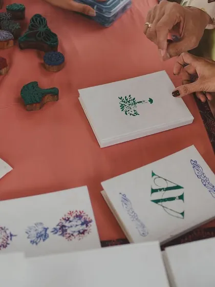At the 'Artisan's Studio' Mehendi, we set up a block-printing station where guests could create their own custom-stamped notebooks, connecting them to the craft-inspired theme.