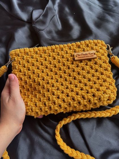 A full view of our mustard yellow crossbody bag, showing the beautiful texture of the macrame knots. This handmade bag is both stylish and durable for daily use.