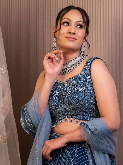 A closer look at a sparkling diamond-style choker necklace. It's the perfect accessory to elevate a simple neckline and add glamour to your reception or cocktail look.