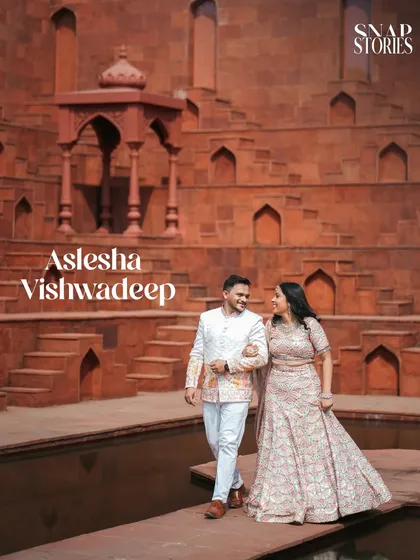 I love using unique and dramatic locations like this historic step-well. The scale and symmetry of the architecture provide a powerful backdrop for a truly unforgettable pre-wedding couple portrait.