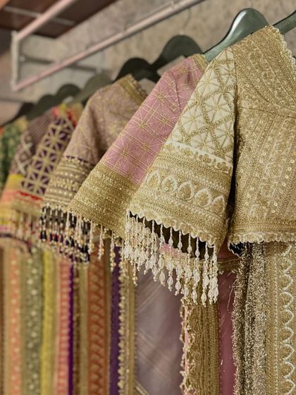 A detailed shot of the embroidered blouse sleeves from the Shikhar Sharma collection, highlighting the tassels and fine craftsmanship.