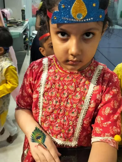 Dressed up for Janmashtami, this little one is ready to celebrate. The hand-painted peacock feather is a small touch that adds so much to the festive feel.