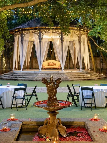 Our bandstand, elegantly draped for an evening reception, showcases its versatility as a romantic setting for dining or dancing under the stars.