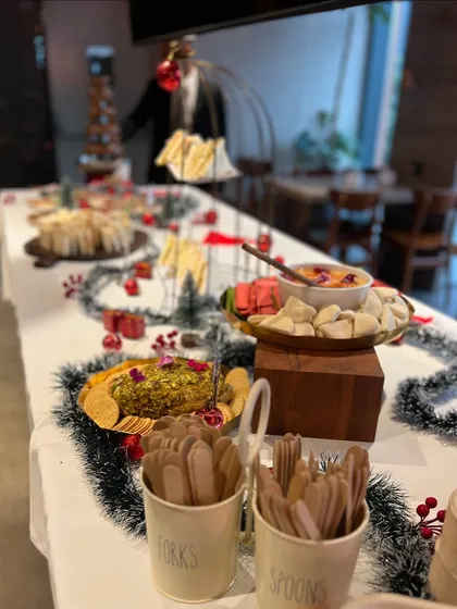 Another view of the Christmas high tea table, showing the festive garlands, mini Christmas trees, and our beautiful serveware. We love creating a festive atmosphere.
