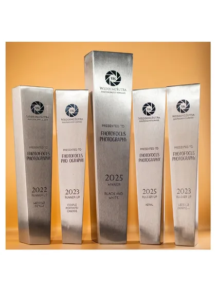 A closer look at our five WeddingSutra awards. These accolades for categories like 'Couple Portraits' and 'Black and White' are a symbol of our consistent quality and creative vision over the years.