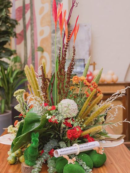 A beautiful, rustic floral arrangement in a wooden box, perfect for a woodland-themed centerpiece.