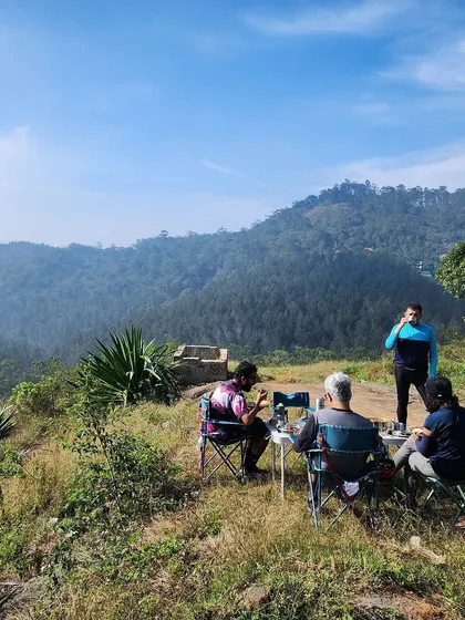 A picnic with a valley view in Yercaud. We believe in rewarding your effort with delicious food in spectacular locations, a signature part of our curated experiences.