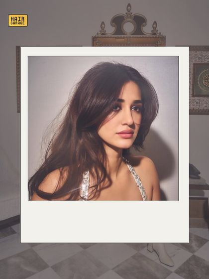 A polaroid-style shot that gives a vintage feel. The soft, blown-out hair is a timeless look that works for any occasion.