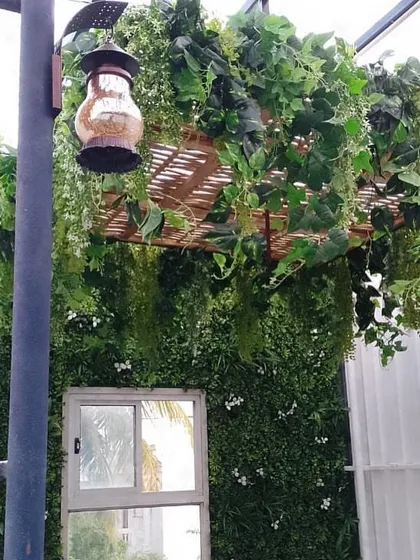 I believe in making every part of a home beautiful, especially areas with natural light. For this project, I added a hanging basket of artificial vines and a green wall to transform a simple window area into a lovely focal point.