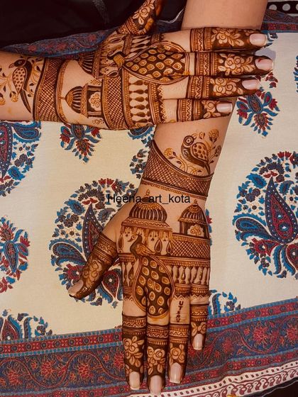 A beautiful back-hand design featuring jharokha (window) architecture and peacock motifs. The intricate patterns give it a royal and traditional feel.