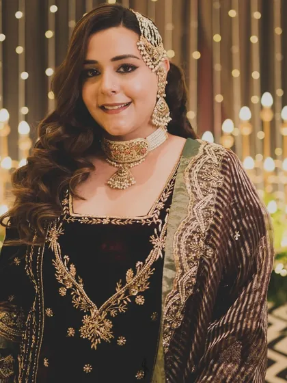 A close-up of the reception look. The rich velvet, subtle embroidery, and the elegant passa on her hair created a look that was regal and sophisticated without being over the top.