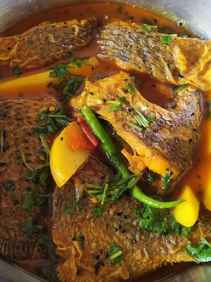 A light and healthy Telapia jhol, made with black cumin seeds, green chillies, and potatoes. After a period of heavy eating, this simple curry is the perfect way to comfort your palate.