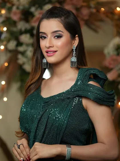 Confident and chic. This look is perfect for a modern sangeet or cocktail party, combining traditional attire with contemporary makeup.