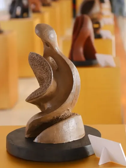 A beautiful terracotta sculpture by Aarti Bhadauria from her 'Rhythm of Emotions' show. The piece captures a sense of fluid movement and organic form.