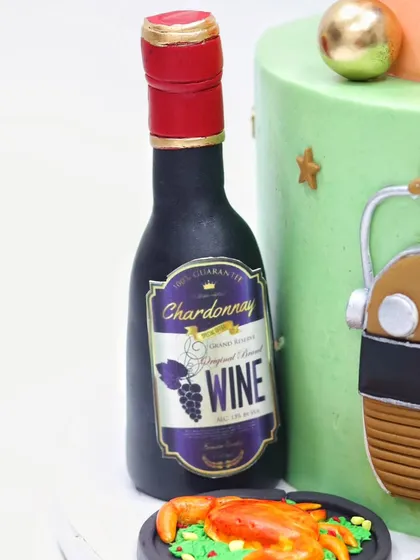 A hand-sculpted, edible wine bottle that was part of the seafood-themed cake.