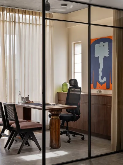My personal cabin is designed for privacy while maintaining a visual connection to the studio. The desk itself embodies our philosophy, pairing a sourced vintage teak leg with a contemporary tabletop, a true juxtaposition of traditional and modern design.