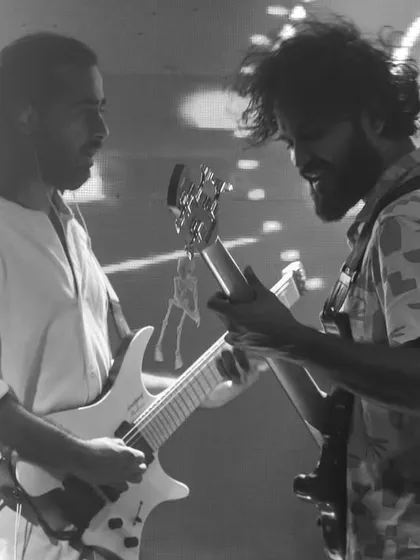 Our two guitarists facing off in a black and white shot. This highlights the powerful guitar-driven sound that is central to our Bollywood rock style.