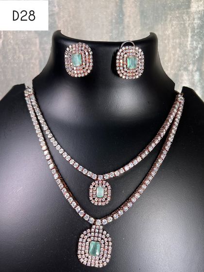 A still image of the rose gold layered necklace with mint green stones. This contemporary jewellery piece is ideal for those who prefer delicate designs.